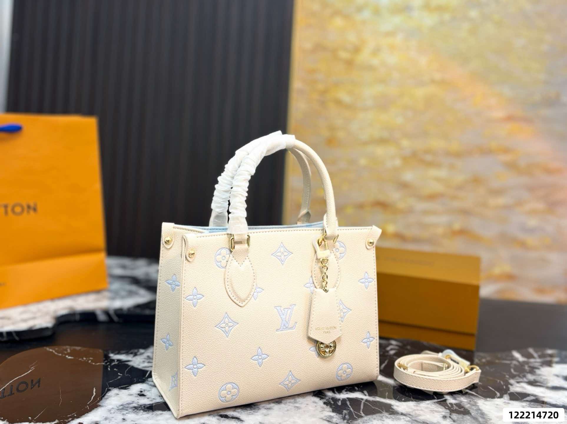 LV On‑The‑Go PM Cream Pink Empreinte Leather Tote Bag