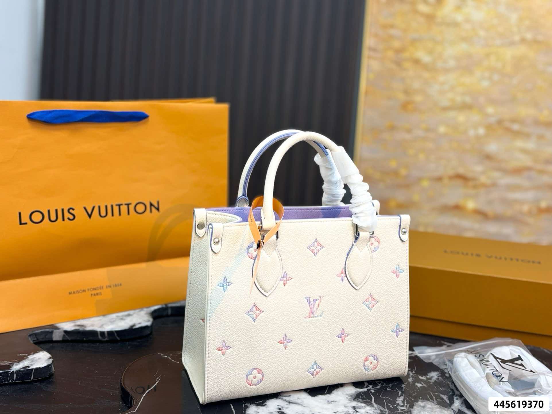 LV On‑The‑Go PM Cream Pink Empreinte Leather Tote Bag