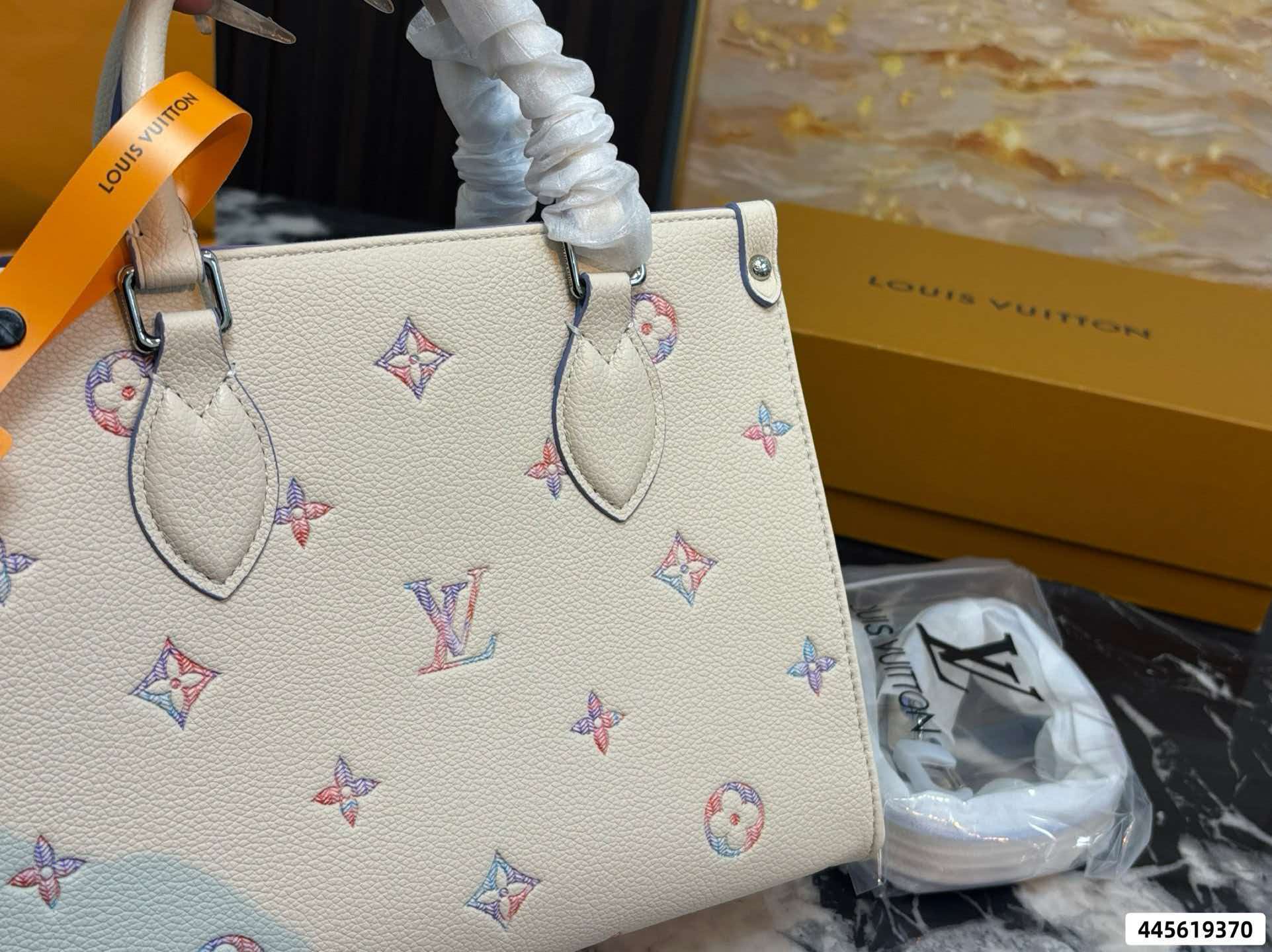 LV On‑The‑Go PM Cream Pink Empreinte Leather Tote Bag