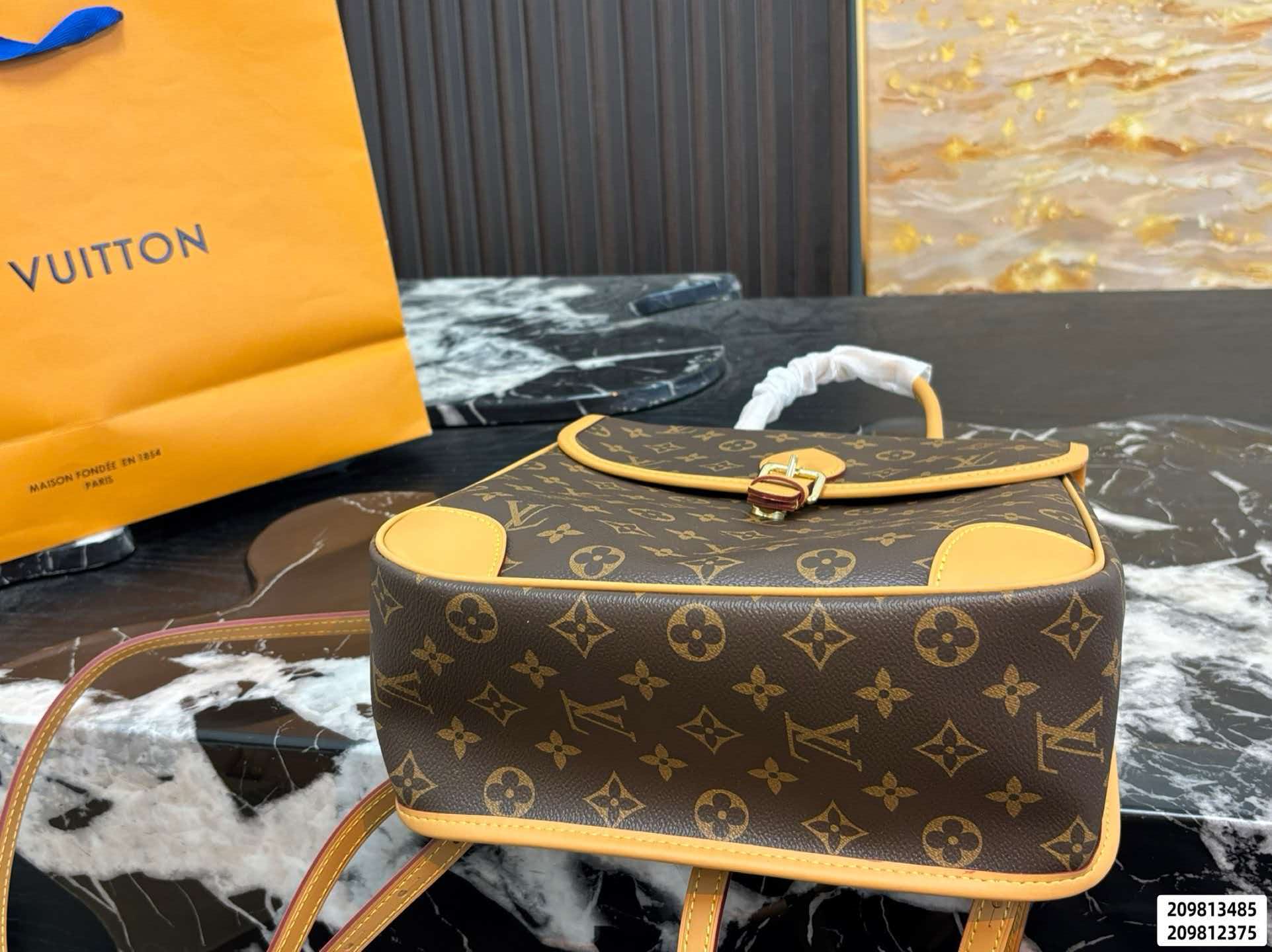 Monogram brown LV Diane Backpack PM, polished gold‑toned hardware with adjustable removable straps