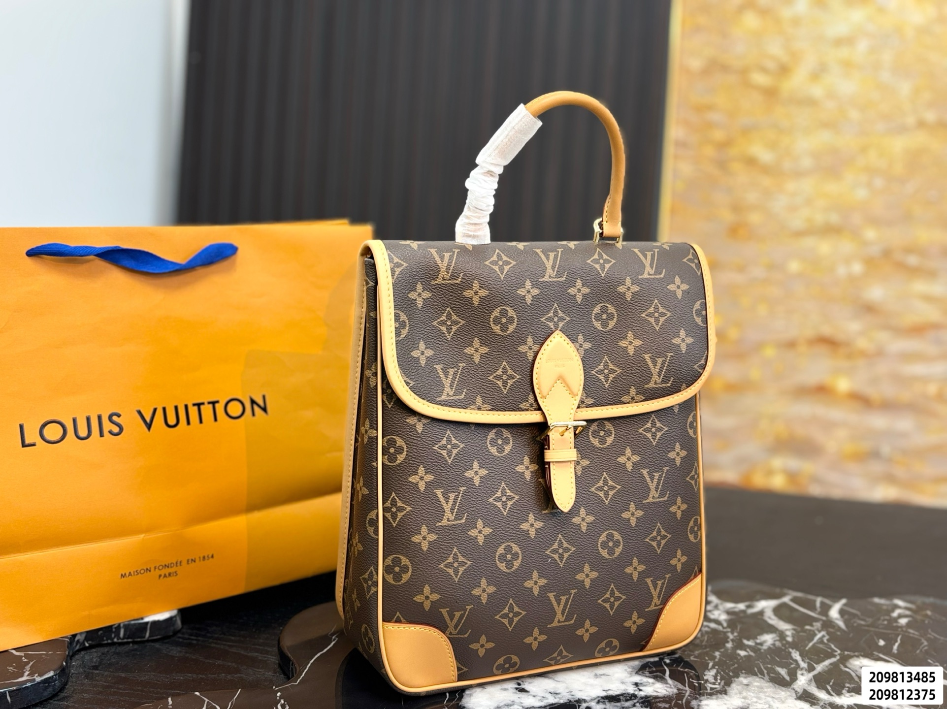 Monogram brown LV Diane Backpack PM, polished gold‑toned hardware with adjustable removable straps