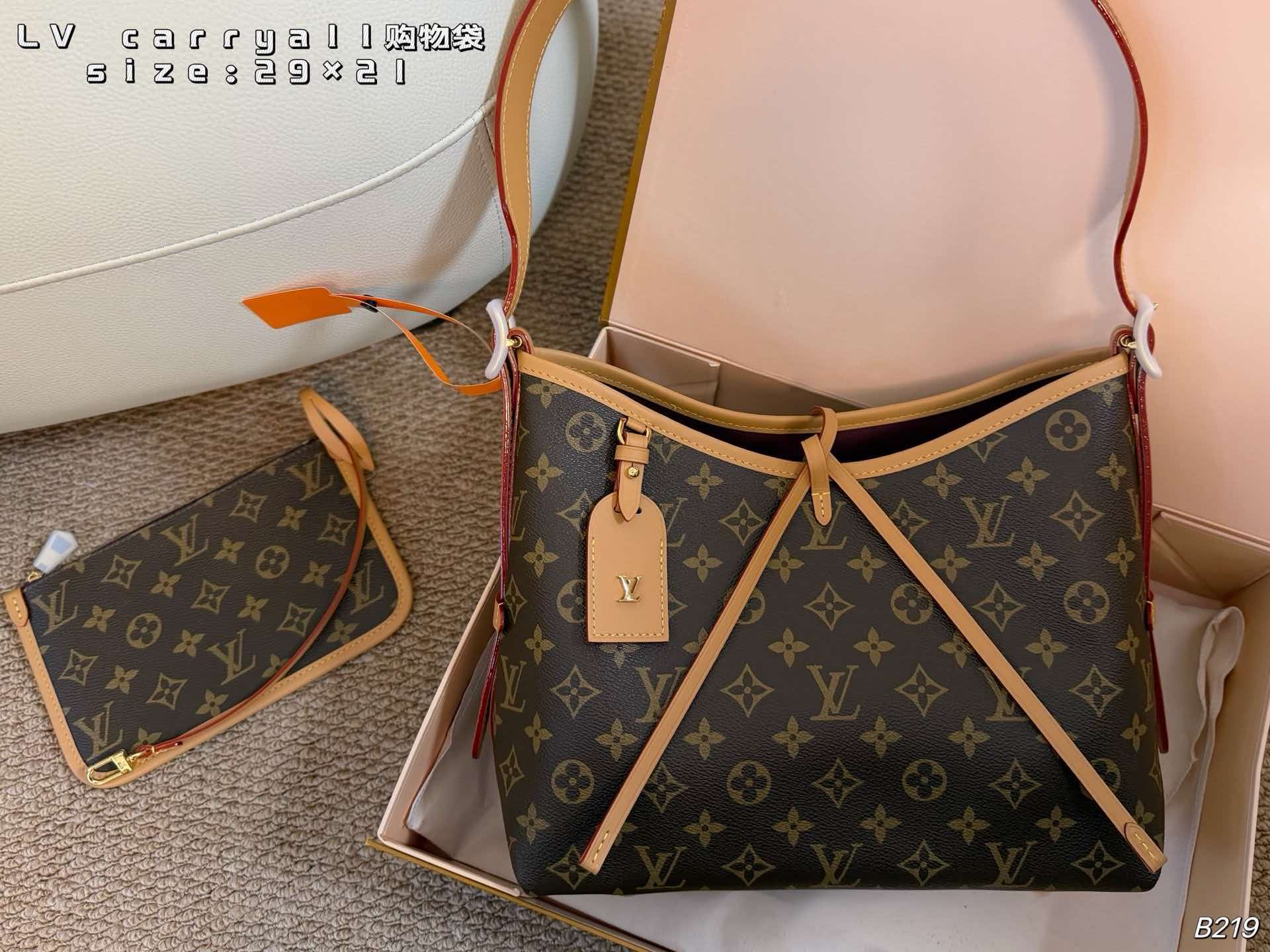 Monogram LV Carryall PM hobo tote with vachetta leather trim, polished gold hardware and matching pouch