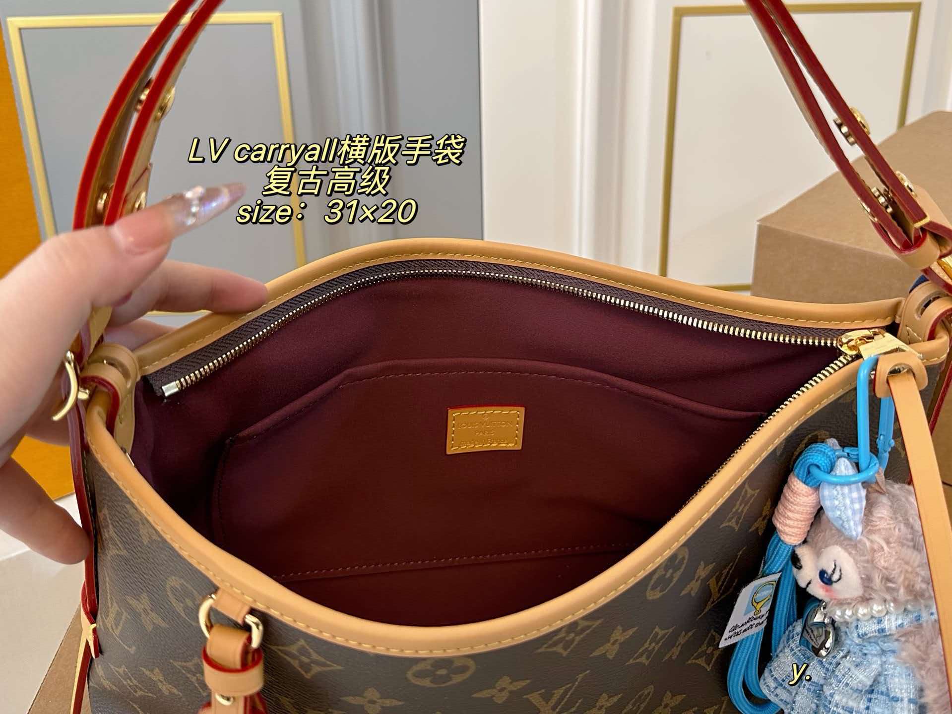 Monogram LV Carryall East West hobo tote with vachetta leather trim, polished gold hardware and detachable name tag