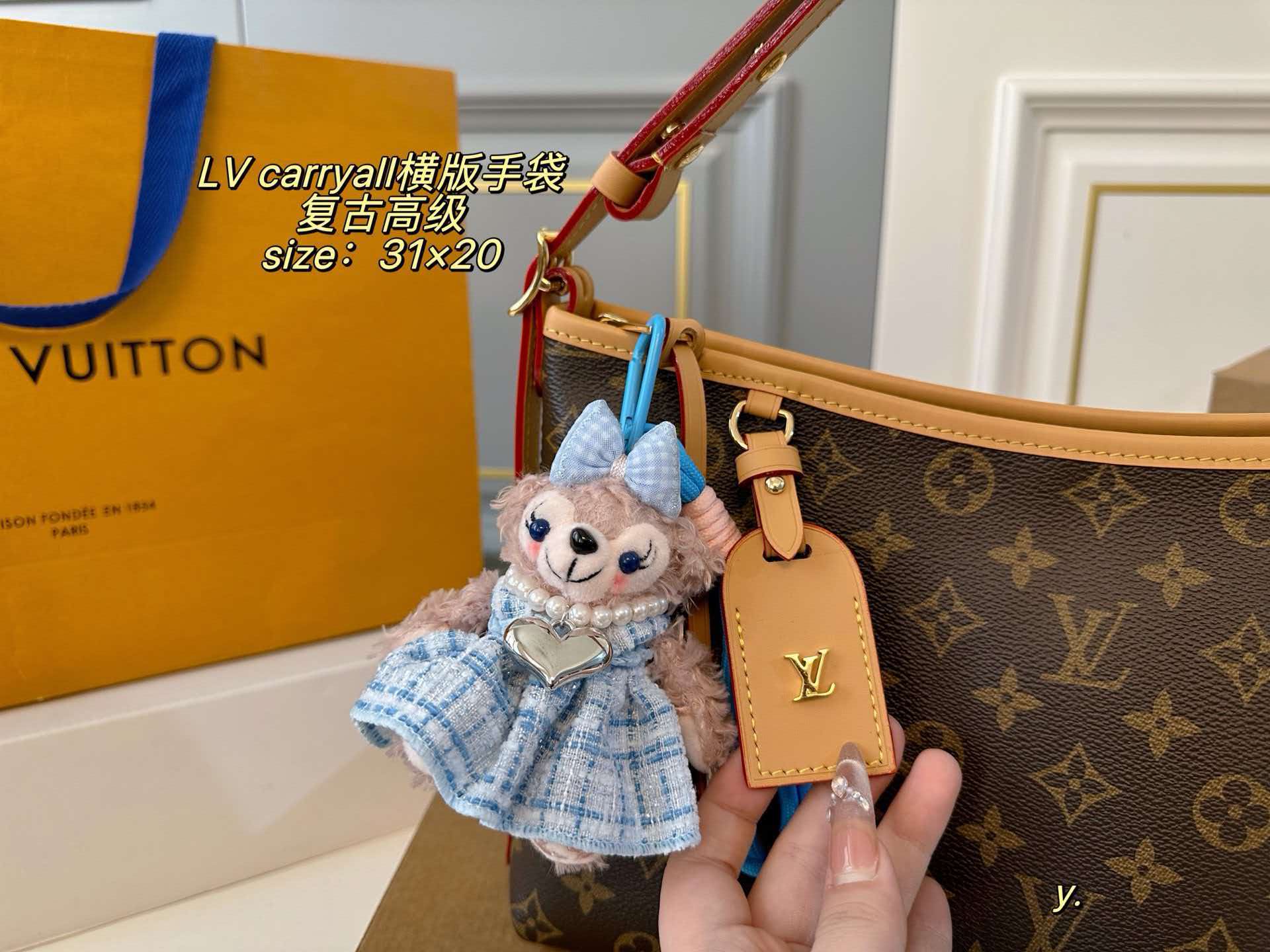 Monogram LV Carryall East West hobo tote with vachetta leather trim, polished gold hardware and detachable name tag