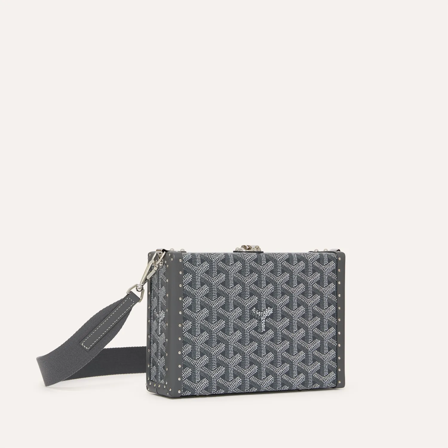 Goyard Bezons PM green trunk crossbody bag, iconic goyardine canvas, calfskin trim, gold‑tone clasp, removable adjustable shoulder strap