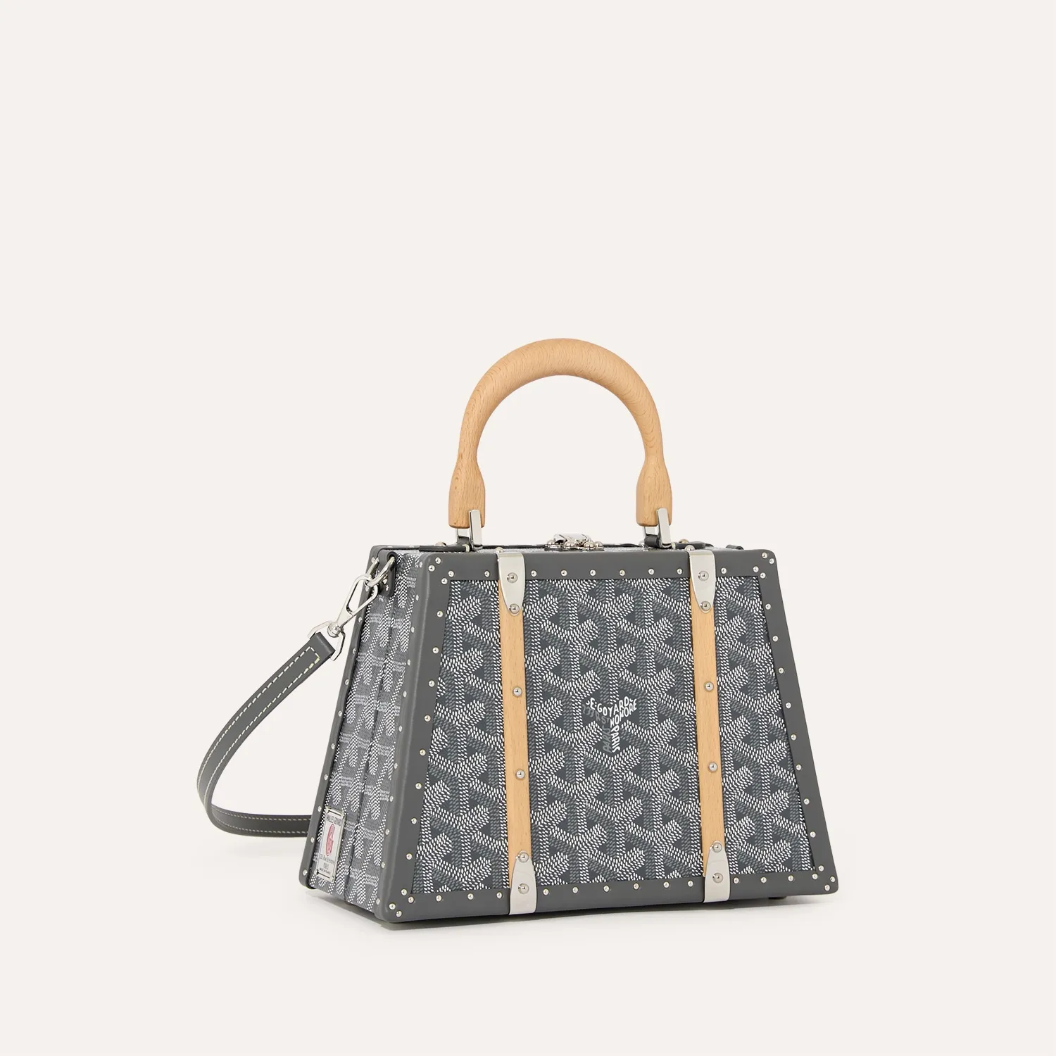 Goyard Sac Malle Saigon Mini green hard trunk bag, iconic goyardine canvas, beechwood top handle, detachable leather shoulder strap, vintage trunk rivet details